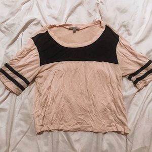 Light pink crop top with black striped sleeves